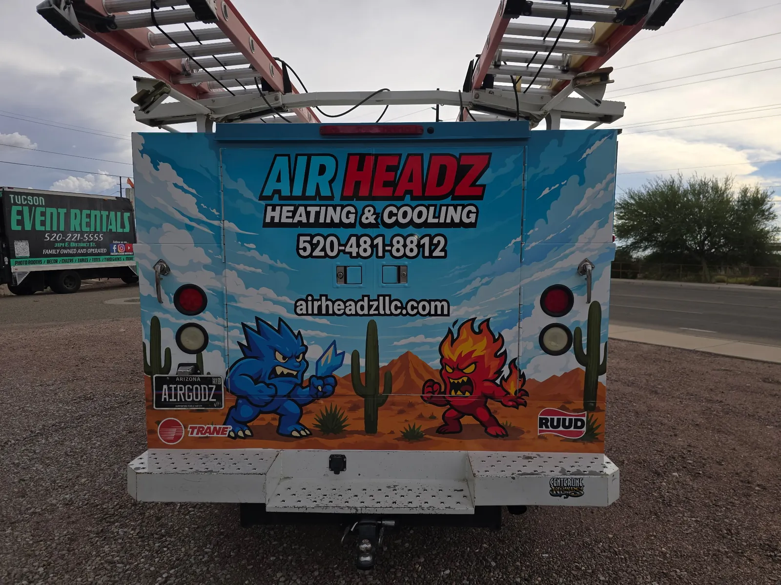 Rear of an AirHeadz service truck with the desert superhero wrap
